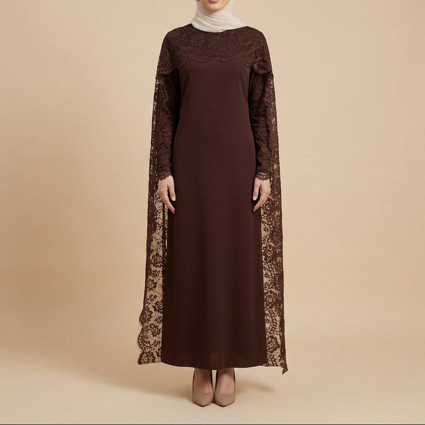 A dark brown long-sleeve maxi dress with lace detailing on the sleeves and collar, displayed on a mannequin in front of a white paneled wall.