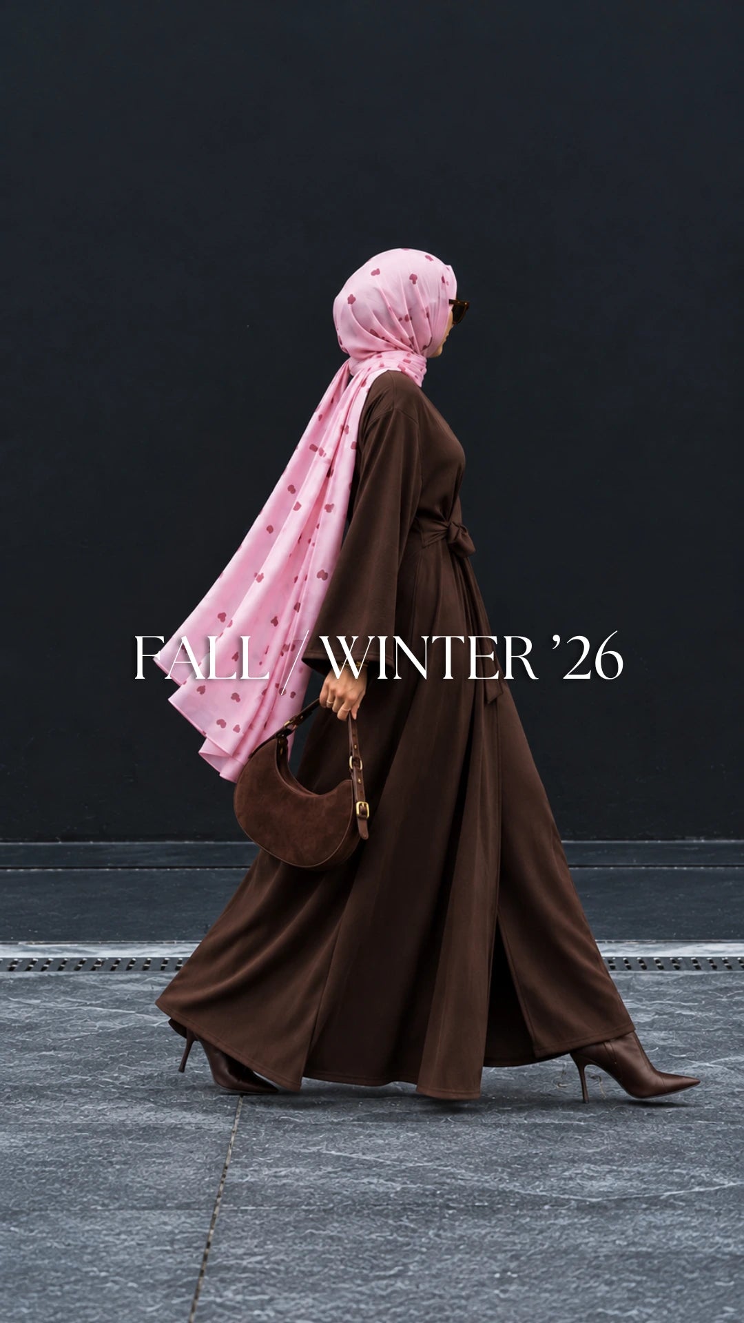Try Modest autumn winter modest fashion featuring a chocolate brown maxi abaya styled with a flowing pink printed modal hijab, leather handbag and ankle boots.